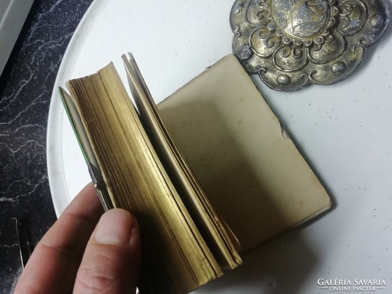 Antique gilded prayer book is in the condition shown in the pictures