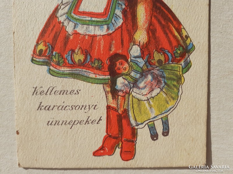 Régi karácsonyi képeslap népviseletes kislány babájával rajzos levelezőlap