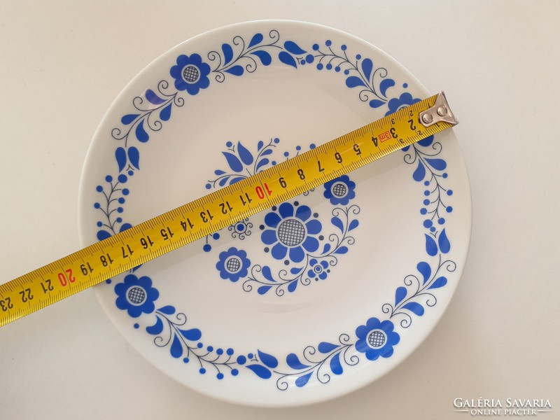 Old lowland porcelain wall plate with floral Hungarian blue folk pattern