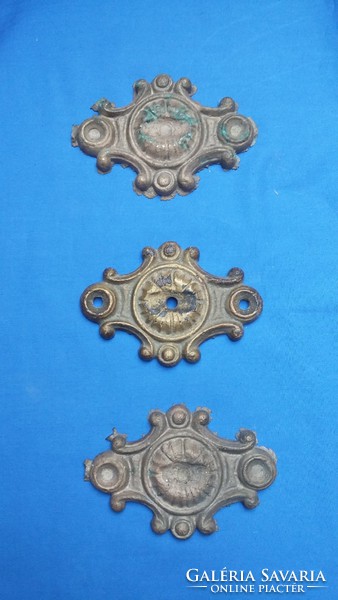 Three solid metal castings (iron, copper): furniture / gate decoration