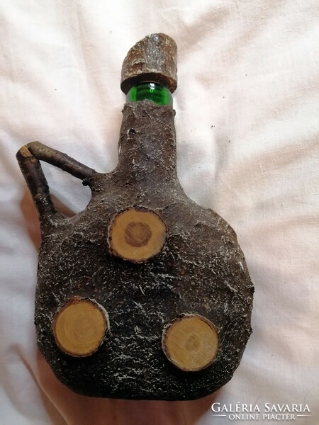 Glass bottle with an old man's face