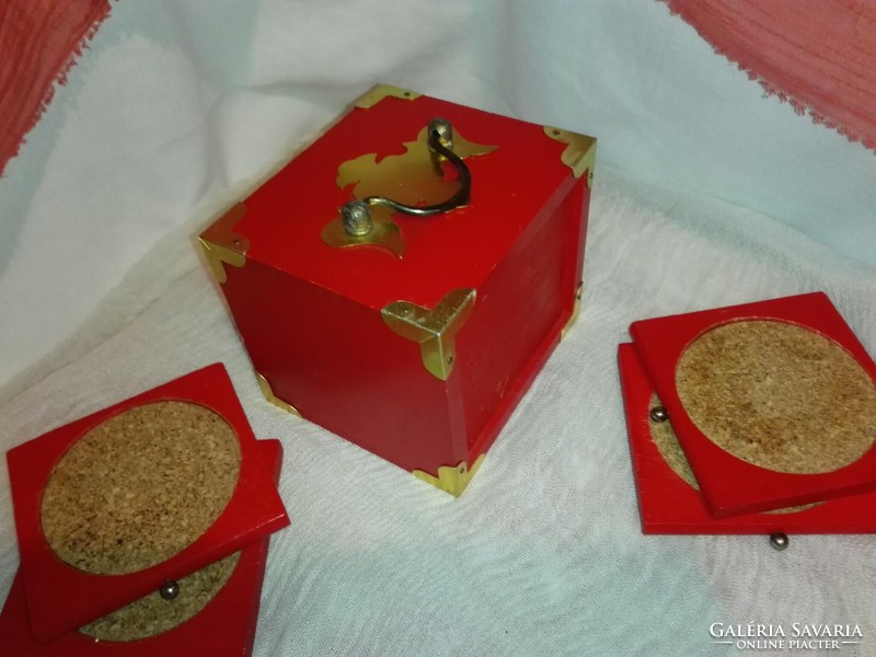 8 cork coasters in a copper-plated wooden box.