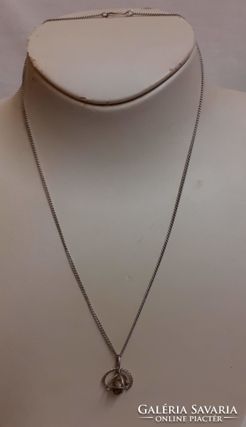 Retro alpaca necklace in good condition with earth planet pendant