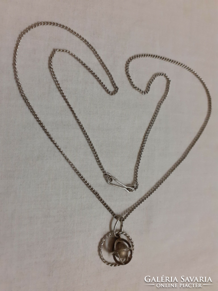 Retro alpaca necklace in good condition with earth planet pendant