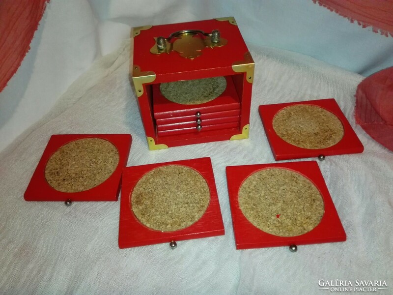 8 cork coasters in a copper-plated wooden box.