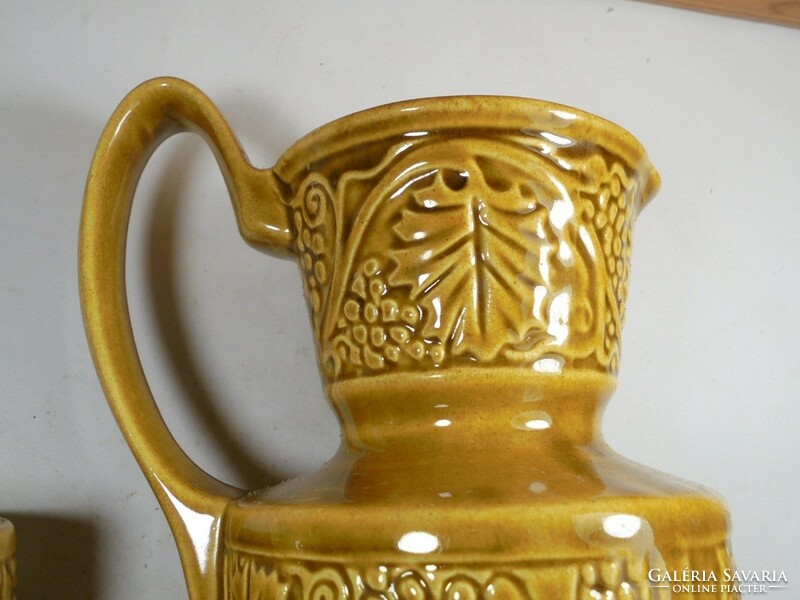 Retro old glazed marked ceramic jug pitcher with cup cup wine grape Greek embossed pattern