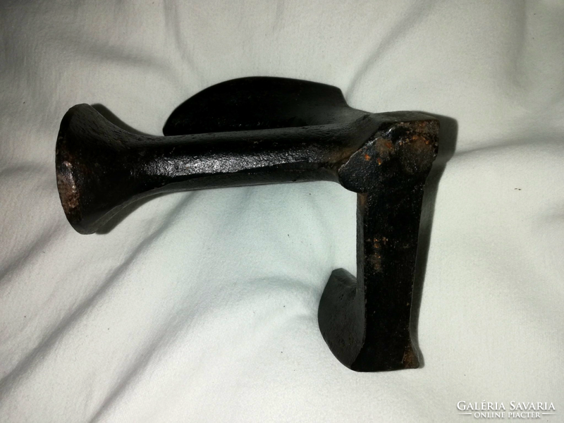 A cast iron awl or something like an anvil