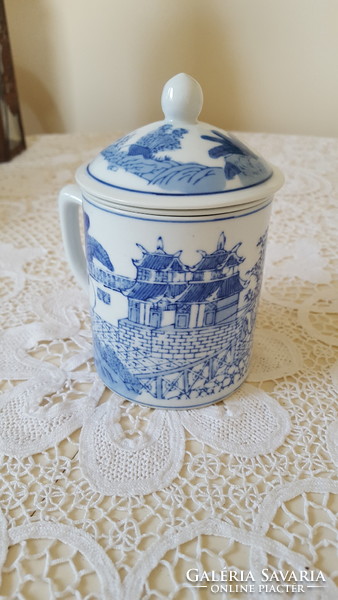 Blue and white porcelain mug with tea filter