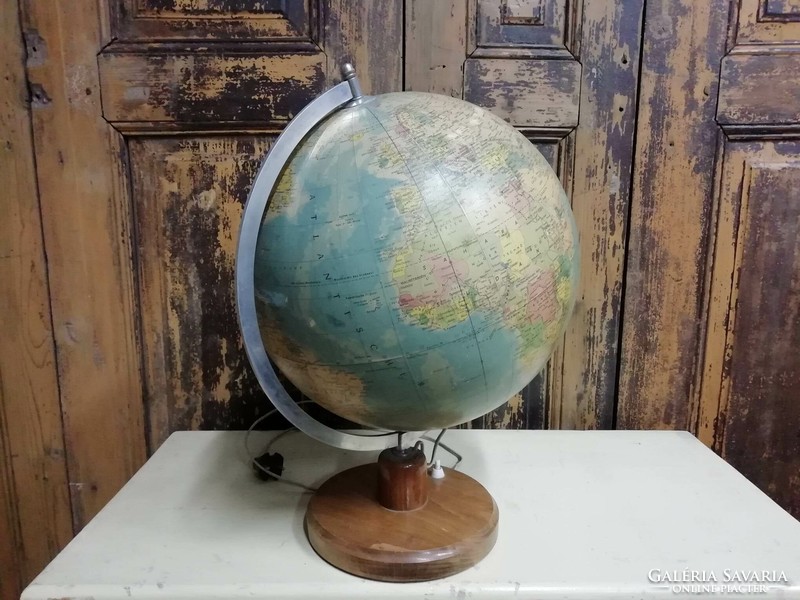 Globe paper, on a wooden pedestal, illuminated, from the end of the 1960s, in good condition, decoration