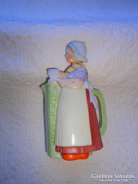 Antique jug with a figure of a Dutch girl