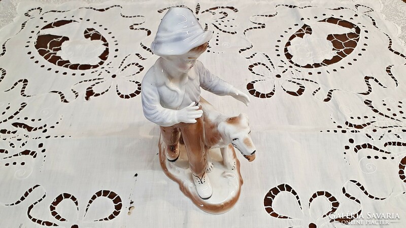 Old, Romanian, crown regent, fine porcelain figure. Boy with dog nip.