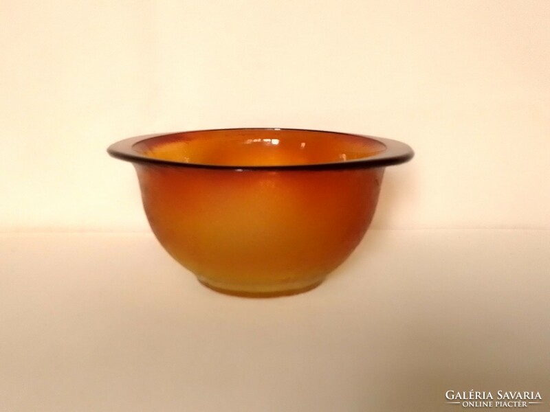 Old amber-colored heat-resistant deep bowl for salad and soup