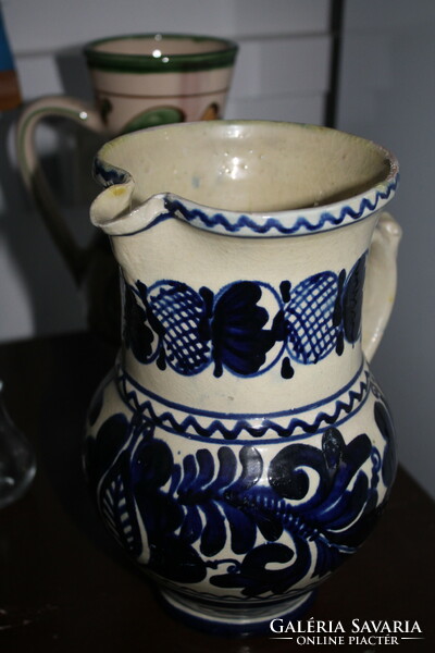 Blue jug with flower pattern (such as Michael Korund)