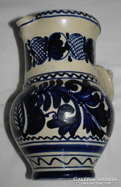 Blue jug with flower pattern (such as Michael Korund)