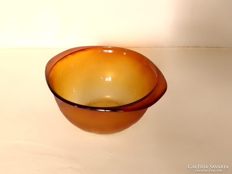 Old amber-colored heat-resistant deep bowl for salad and soup