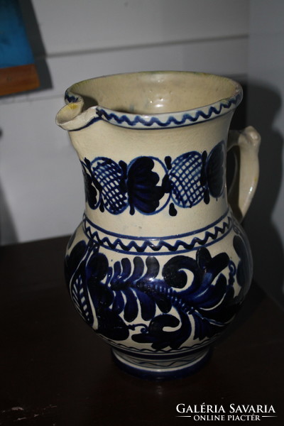 Blue jug with flower pattern (such as Michael Korund)