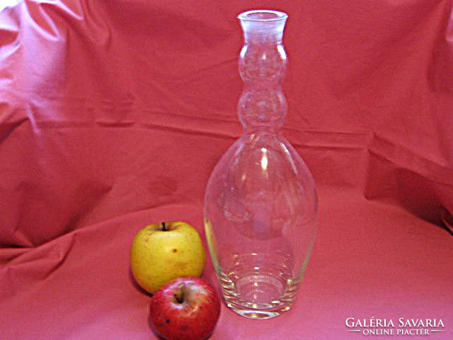 Blown antique bottle with wavy neck, offering