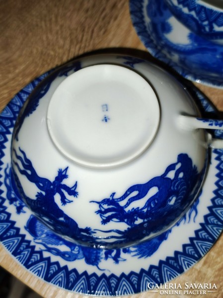 Porcelain tea cups and saucers