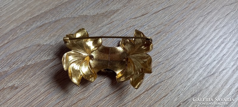 Old gilded art nouveau brooch made of copper