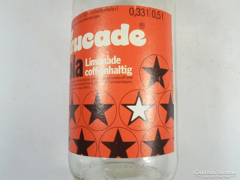 Small glass bottle with retro paper label - frucade cola 0.33 l made in Germany - from the 1990s