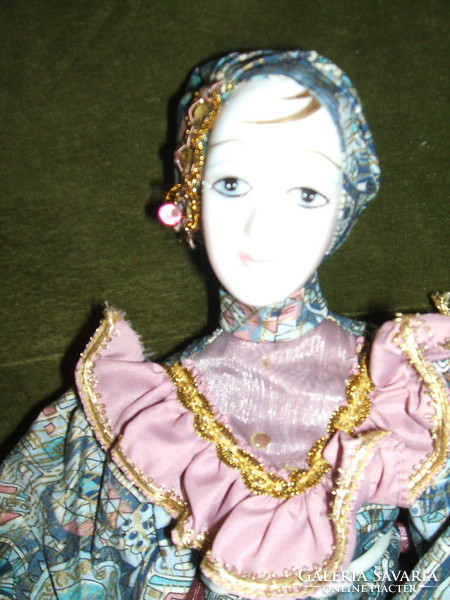 Venetian porcelain doll with stand