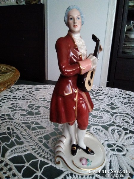 Old royal dux porcelain baroque man with lute, beautiful shades.