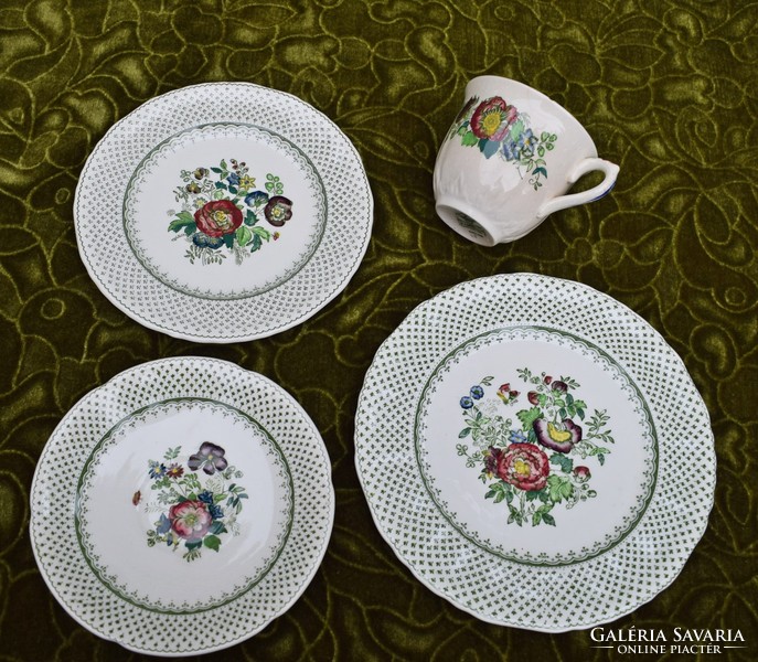 Old manson's cup with plates of English faience breakfast set for a person slightly damaged