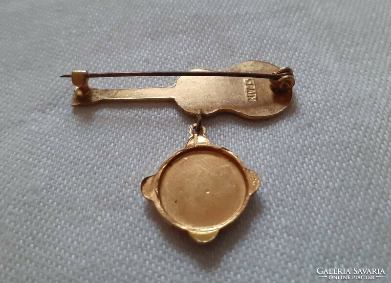 Spanish gold colored brooch
