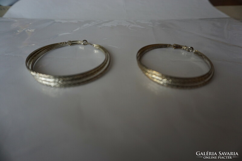 3 Stainless metal wire alloy hoop earrings for sale.