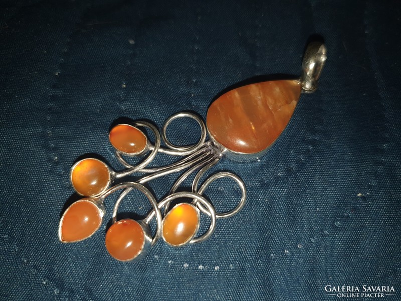 A wonderful carnelian pendant set in silver, in a unique style