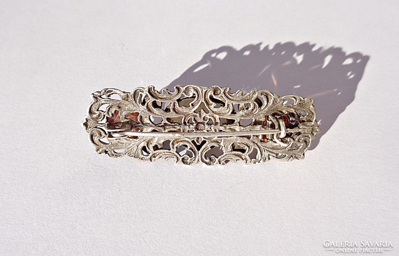 Silver brooch with seven stones