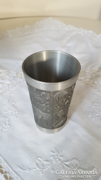 Tin cup decorated with figural patterns
