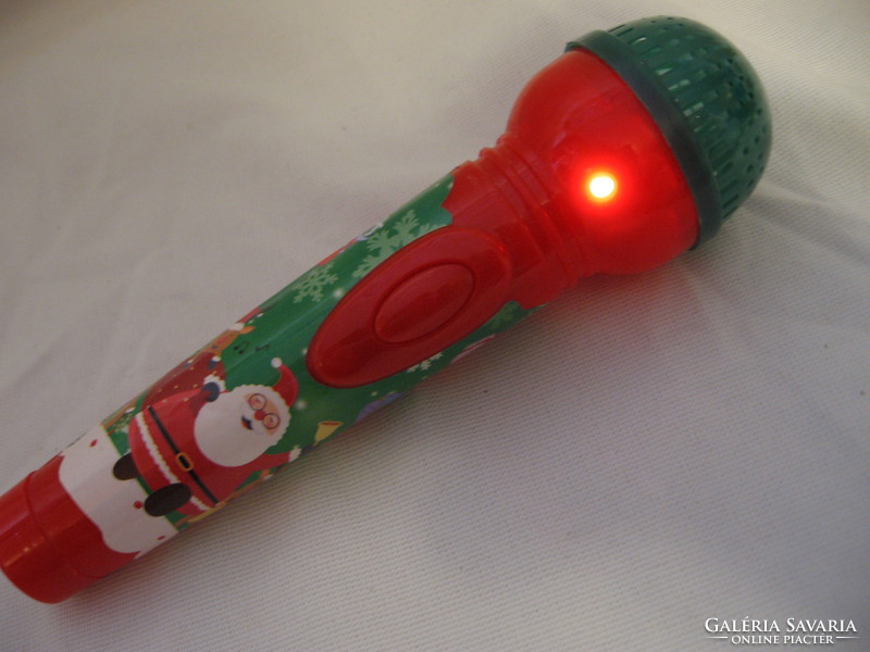 Musician singing with illuminated Santa's microphone jingle bells