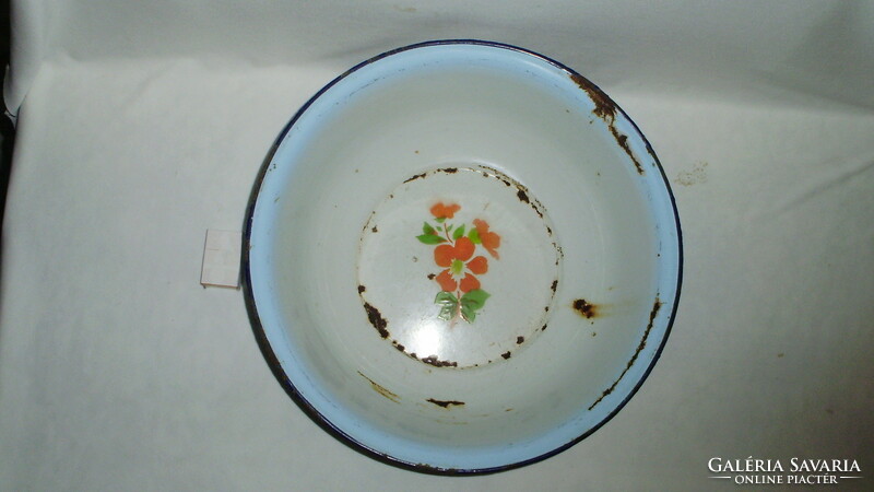 Old, flowery, pale blue edged enamel bowl marked 