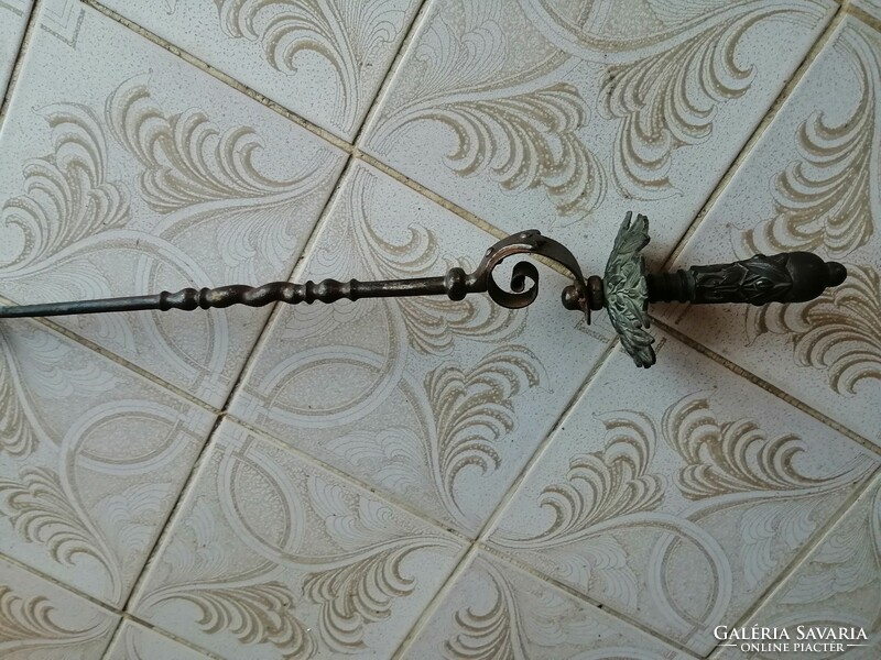 Antique bronze fireplace accessory with handle