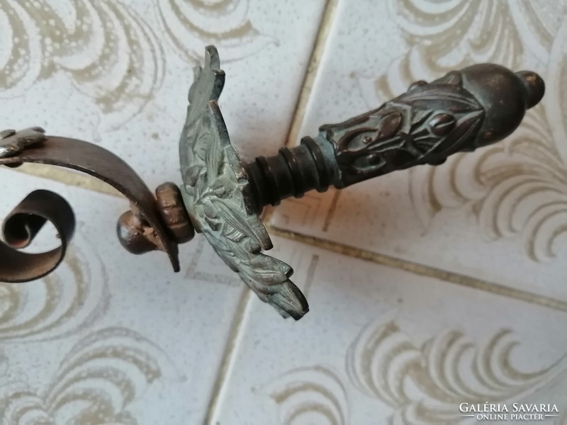 Antique bronze fireplace accessory with handle