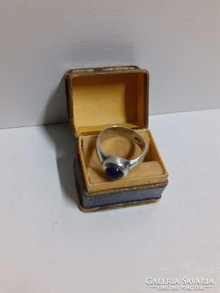 Marked silver ring set with an amethyst stone in its box