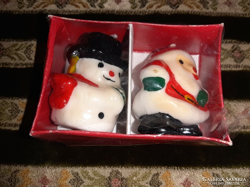 Old candles Santa Claus and snowman figure
