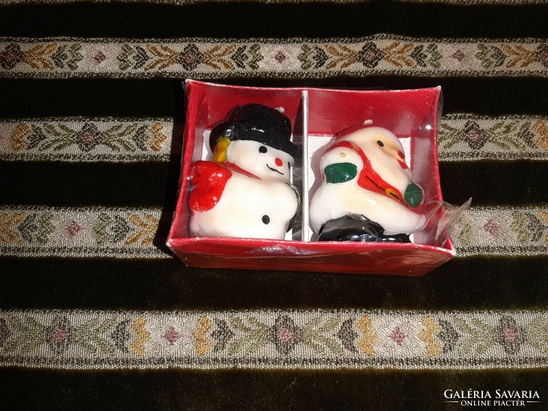Old candles Santa Claus and snowman figure
