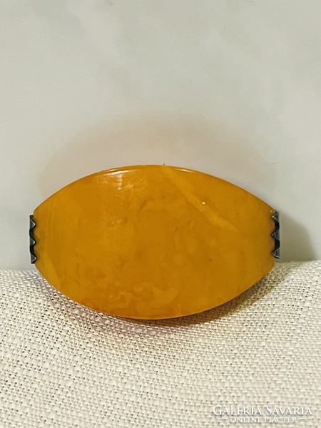 Amber brooch with silver socket