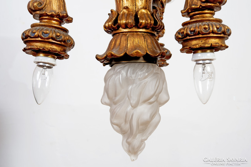Gilded wooden chandelier - with plastic lion heads