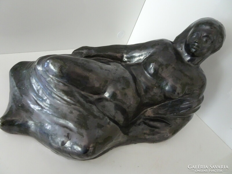 Very beautiful lying female ceramic nude sculpture.