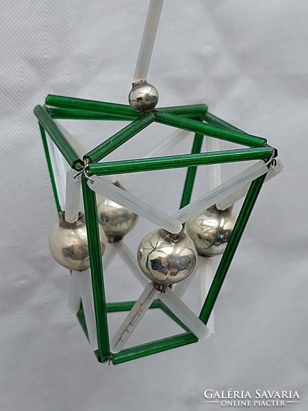 Old glass geometric Christmas tree decoration with green lantern glass ornament