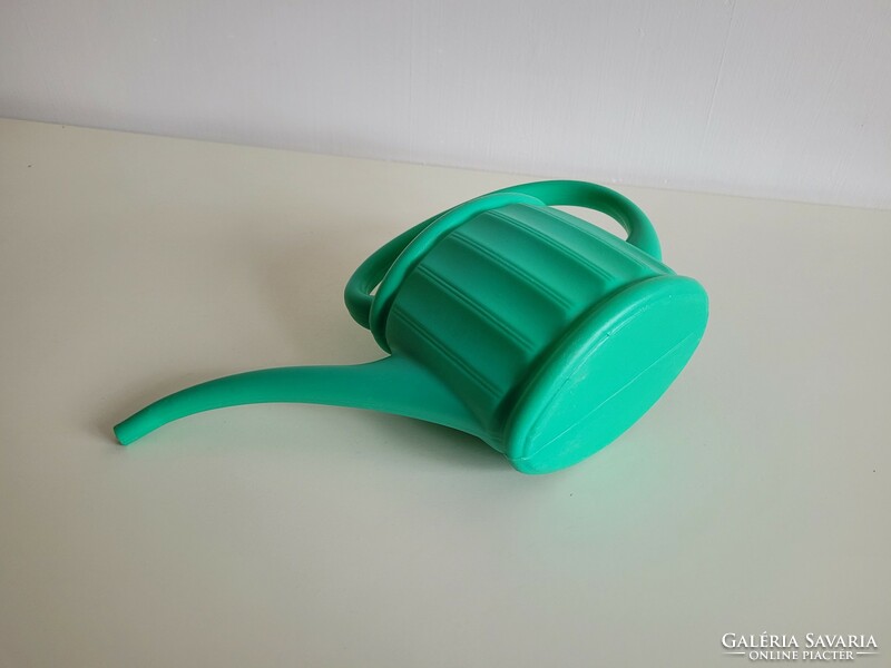 Retro old green plastic watering can watering can watering can
