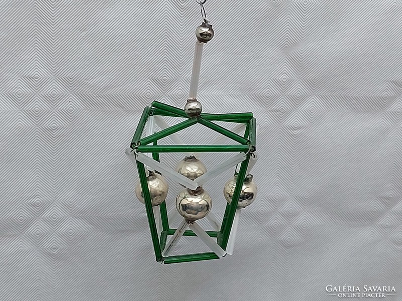 Old glass geometric Christmas tree decoration with green lantern glass ornament