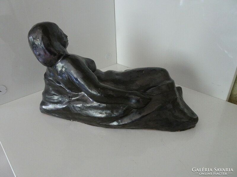 Very beautiful lying female ceramic nude sculpture.