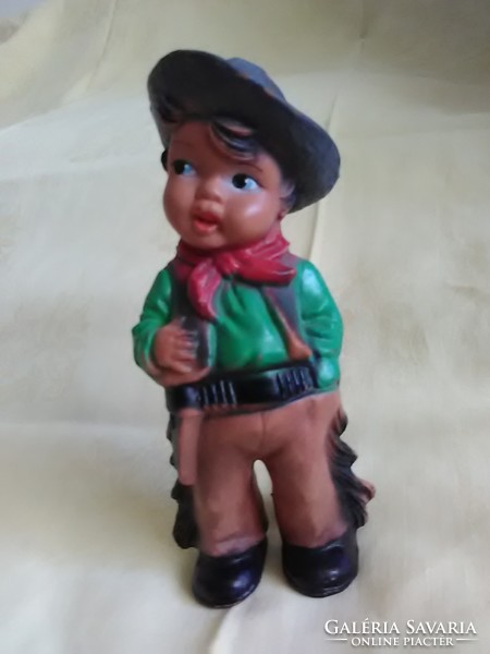 Old rubber toy little cowboy whistling rubber figure
