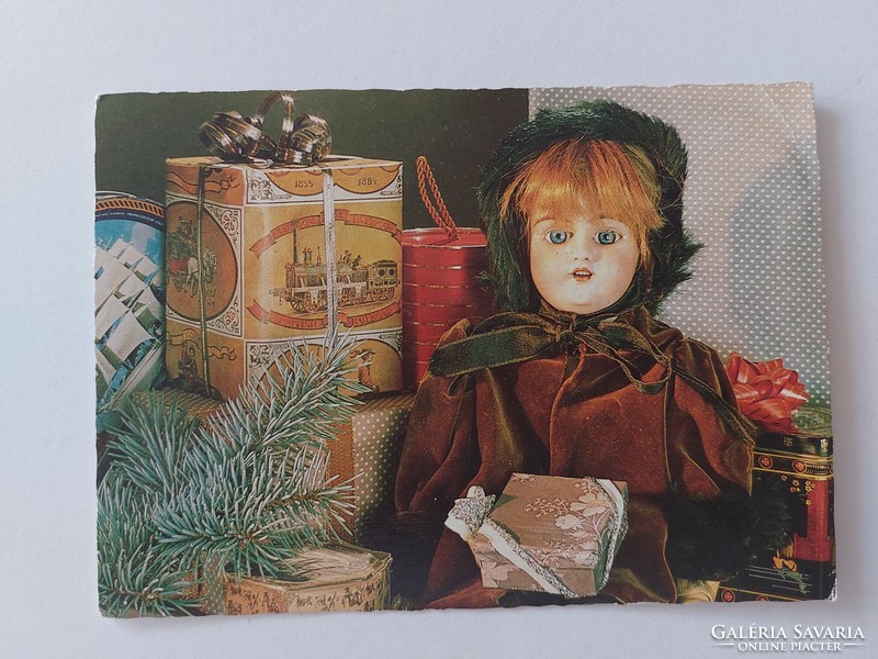 Old Christmas card retro postcard with metal boxes with doll
