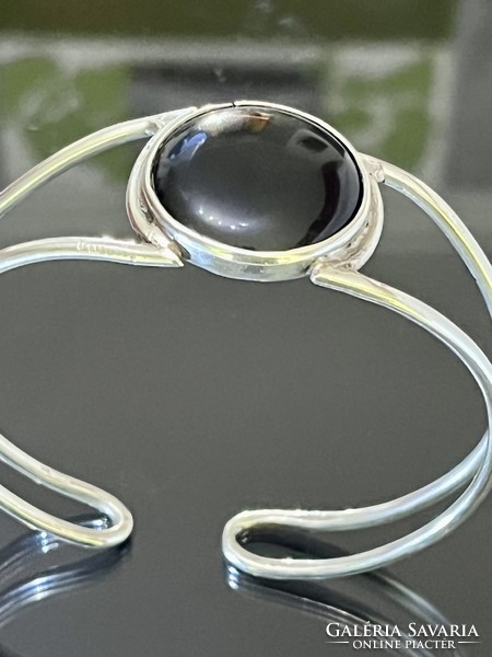 Silver bracelet with a large onyx stone