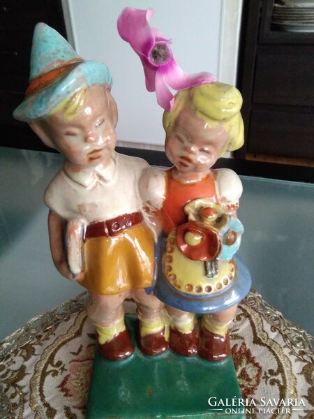 Figures of hoppy children, with a rare flower holder design on the little girl's head from the 1930s!